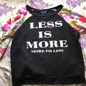 Floral sleeved “Less is more” sweater